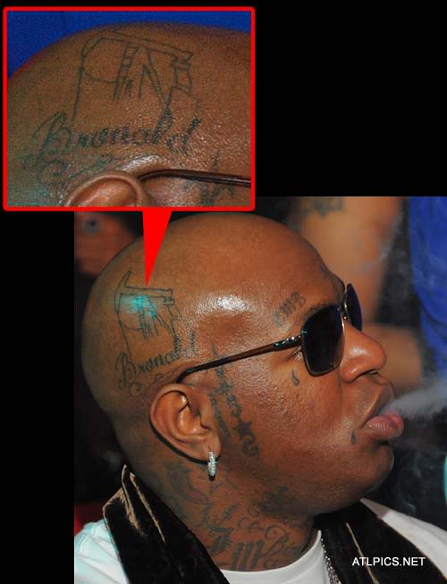 lil wayne tattoo meanings. baby on arms Lil wayne amp